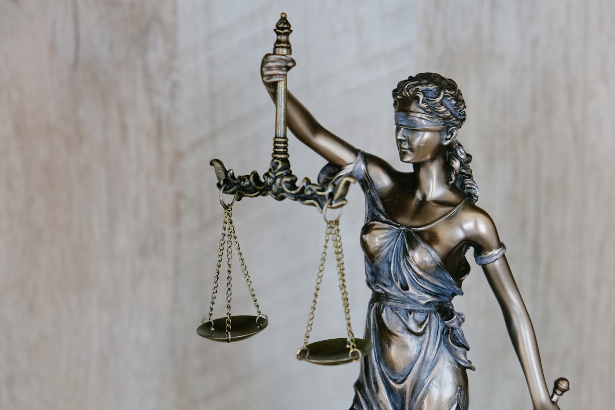 Scales of justice and law books in a law office